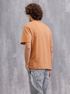 Solid Oversized T-Shirt With Printed Canvas Patch And Raw Edge Detail | Brown